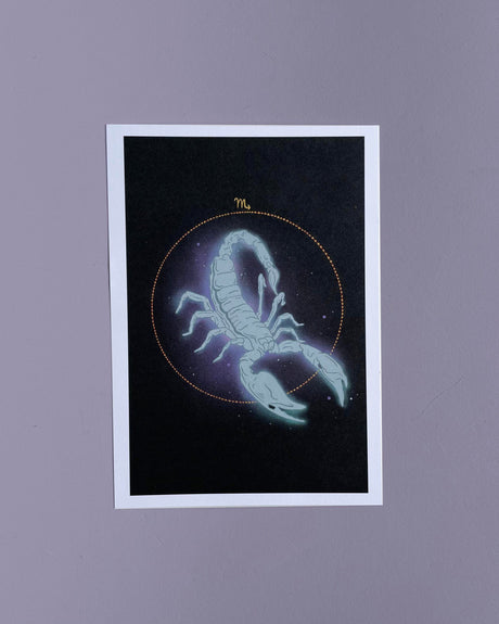 A 5x7 print of a hand-drawn illustration of a scorpion with a UV reactive background, representing the Scorpio zodiac sign.
