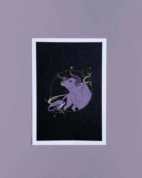 A 5x7 print of a hand-drawn illustration featuring a purple bull with a magical symbol and golden details on a dark background.