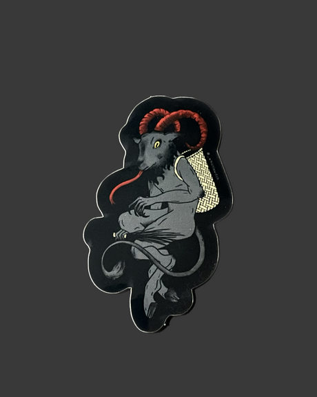 A black vinyl sticker featuring a stylized illustration of a mythical creature, possibly Krampus, with red and gold accents.