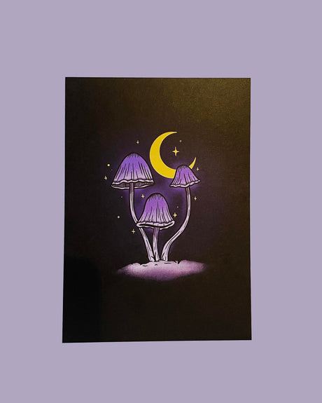 A 5x7 print of a magic mushroom design with a crescent moon and stars on a black background.